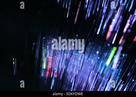 Futuristic abstract background with vertical glowing fiber optic lines. Concept of big data, artificial intelligence, and global digital network Stock Photo