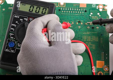 Hardware engineer testing electronic motherboard in service center Stock Photo