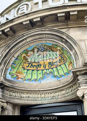 mosaic "thrift is blessing" above entrance of historic former Edinburgh savings bank building Fountainbridge branch now Don&tokyo japanese restaurant Stock Photo