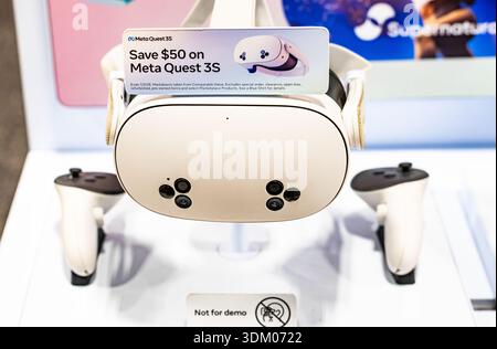 Meta Quest 3S virtual reality headset with controllers displayed on retail stand, modern VR gaming technology and immersive entertainment device Stock Photo