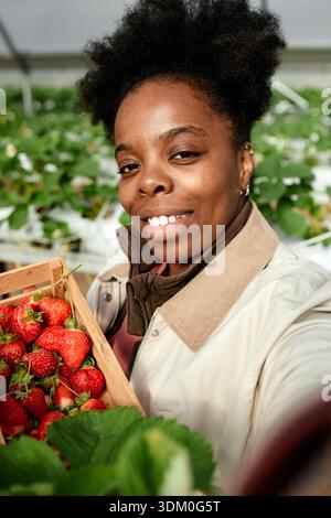Portrait of Smiling Woman with Basket of Strawberries Stock Photo - Alamy