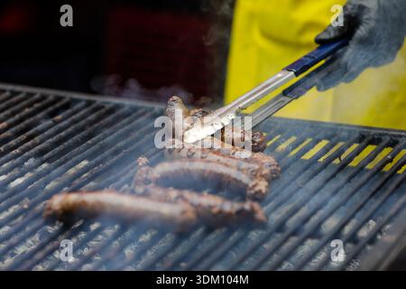 Details with Romanian traditional sausages on a charcoal metal grill. Stock Photo