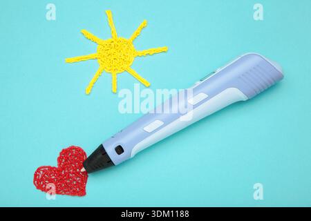 3d handle pen and 3d painting figures on blue background Stock Photo