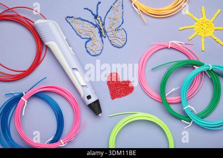 3d handle pen and 3d painting figures on purple background Stock Photo