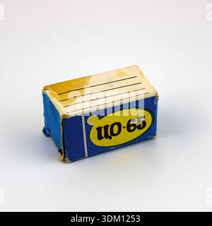 Small vintage Soviet-era matchbox with Cyrillic text, isolated on a white background. Stock Photo