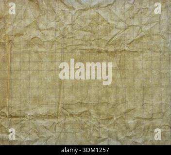 Wrinkled old paper sheet with creases and worn beige texture, full frame background. Stock Photo