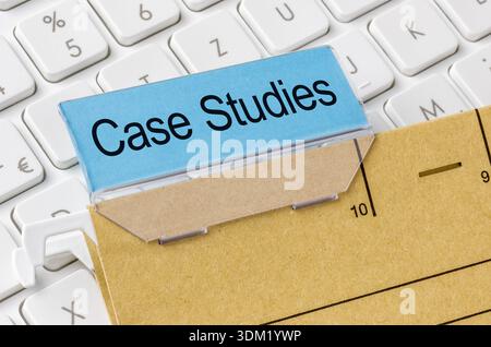 A brown file folder labeled with Case studies Stock Photo
