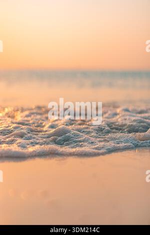 Serene Dreamy Sunset Beach Close Up Waves Sandy Shore Tropical Coastline Blurred Horizon Ocean Seascape Background Peaceful Escape Stock Photo