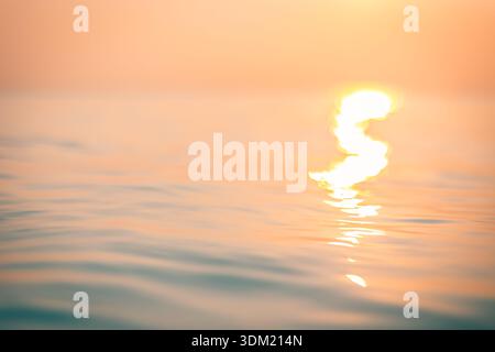 Dreamy artistic blur warm golden ocean sunset horizon soft focus seascape abstract nature background summer escape wallpaper Stock Photo