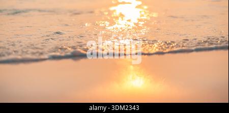 Abstract beach shore golden sun reflection waves wider stunning breathtaking tropical paradise travel destination. Calm ocean water splash relax art Stock Photo