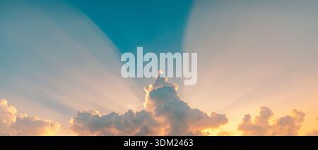 Panoramic sky clouds sunset sunrise sunlight rays peaceful nature background scenic atmosphere Stock Photo