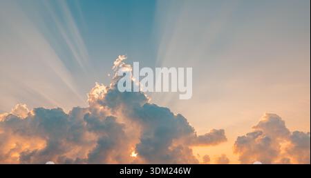 Breathtaking majestic sunset sky gold orange clouds sun rays beams panoramic wallpaper dramatic heavenly nature landscape horizon scenic light dusk Stock Photo