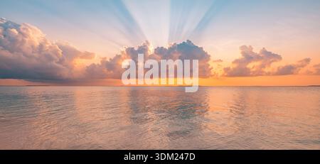 Stunning panoramic ocean view sunset sky sunlight rays peaceful clouds horizon inspire nature background vibrant seascape beauty Stock Photo