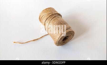 Skein of rope on a white background. Single thread. Jute rope. Roll of twine. Stock Photo