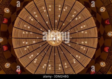Spectacular Crystal Chandelier and Ornate Dome Interior Viewed from Below Al Fateh Mosque. Stock Photo