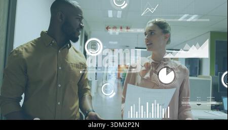 Walking coworkers discussing data in office, woman in pink blouse holding docs, man with watch, HUD Stock Photo