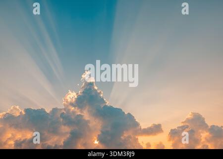 Beautiful sunset sky rays beams idyllic sunrise clouds colorful heaven landscape light dream scenery evening glow bright morning light Stock Photo