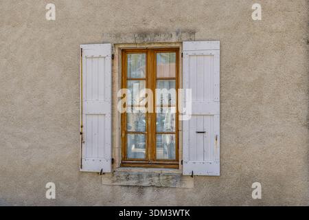 Old house shutters and door on stone wall Provence charming rustic architecture detail French countryside Stock Photo