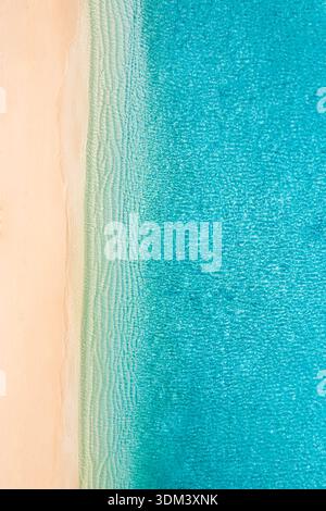 Summer seascape beautiful waves, blue sea water in sunny day. Top view from drone. Ocean aerial view, amazing tropical nature tropical background Stock Photo