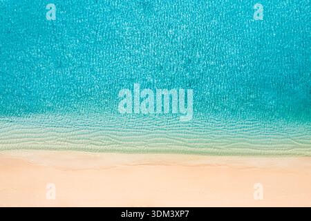 Summer seascape beautiful waves, blue sea water in sunny day. Top view from drone. Ocean aerial view, amazing tropical nature tropical background Stock Photo