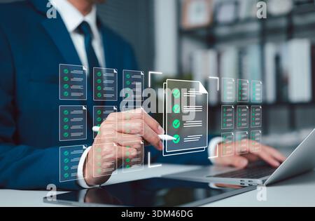 Digital document management concept showing business approval workflow, checklist verification, and compliance review, with professional using laptop Stock Photo