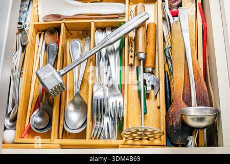 tableware and other cooking tools in a wooden organizer Stock Photo