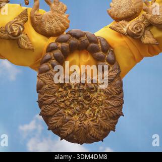 Beautiful Easter bread baked in the form of baskets wicker handle, and diverse forms of bread rolls. Photographed on the background of blue sky Stock Photo