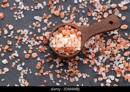Fine Himalayan pink salt - Pure crystal salt in a measuring spoon. Stock Photo