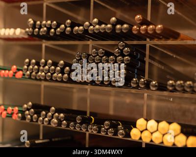 Art and stationery store displaying numerous colored pencils on organized shelves Stock Photo