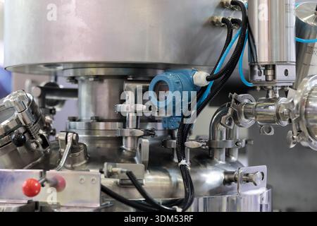 Chemical equipment with smart control gauge for use in explosive atmosphere. Selective focus. Stock Photo