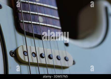 Close up macro shot of feature on white guitar. Detail is shown in nice light Stock Photo