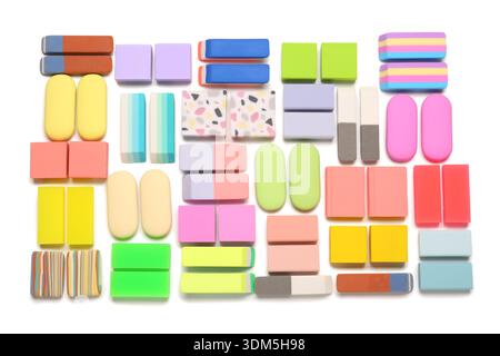 Many colorful rubber erasers on white background Stock Photo