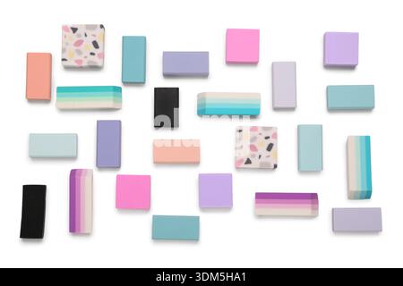 Many colorful rubber erasers on white background Stock Photo