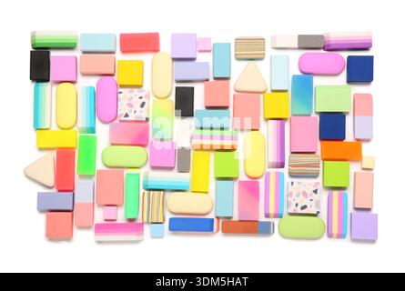 Many colorful rubber erasers on white background Stock Photo