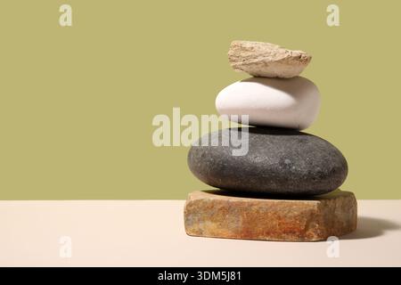 Stack of different sea stones on colorful background Stock Photo