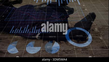 Lying person wearing dark jacket, plaid shirt, boots on sandy ground, displaying translucent graphs Stock Photo