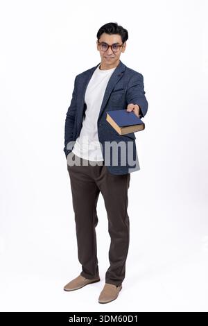 Young man in blue shirt holding a blue folder Stock Photo