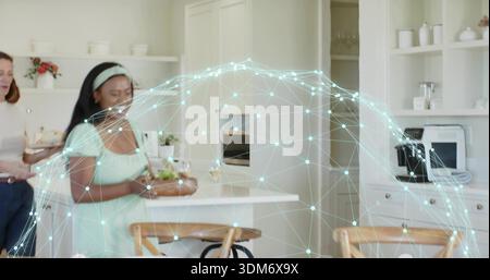Holding wooden bowl, woman wearing mint-green dress headband moving through kitchen, mesh overlay Stock Photo