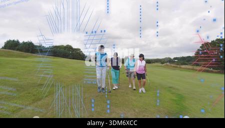 Walking four golfers carrying golf clubs on mowed fairway, wearing polo shirts and caps Stock Photo