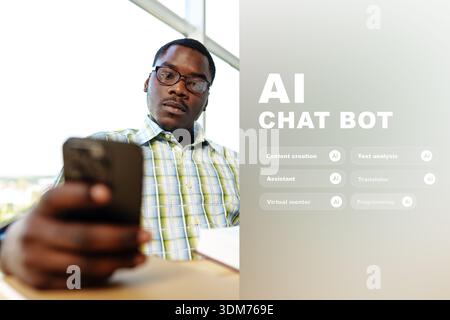 Man using smartphone in modern workspace while engaging with AI tools Stock Photo