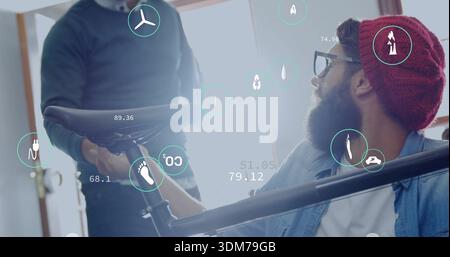 Steadying man wearing denim, glasses, red beanie holding bicycle frame in lit workshop, AR overlays Stock Photo