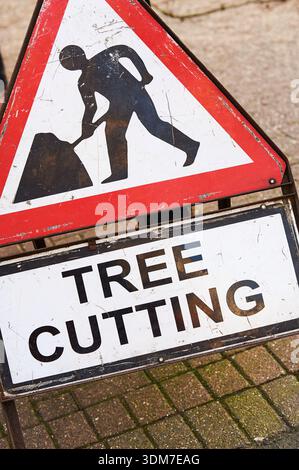 Triangle warning sign of tree cutting work Stock Photo - Alamy