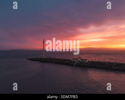The last of the colour during a fiery sunset over the Bull Wall Stock Photo