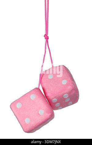 Pair of pink fuzzy dice hanging on white background Stock Photo