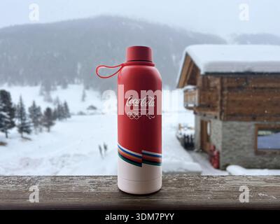 Livigno, Italy - February 3, 2026: Branded Coca Cola volunteer