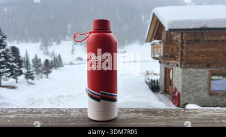 Livigno, Italy - February 3, 2026: Branded Coca Cola volunteer