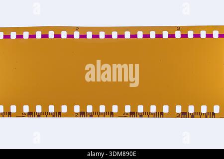 Blank 35mm Film Strip — Yellow Negative Frame with Perforations Stock Photo