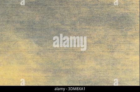 Washed denim fabric showing a textured blue and yellow weave pattern for background use Stock Photo