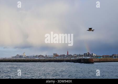 View from the southern pier to Scheveningen with a small rainbow. Stock Photo