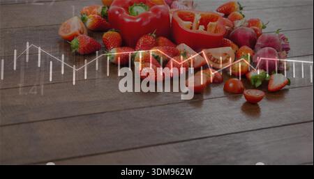 Showing cut strawberries, tomatoes, red bell pepper, radishes on wood tabletop, white chart overlay Stock Photo